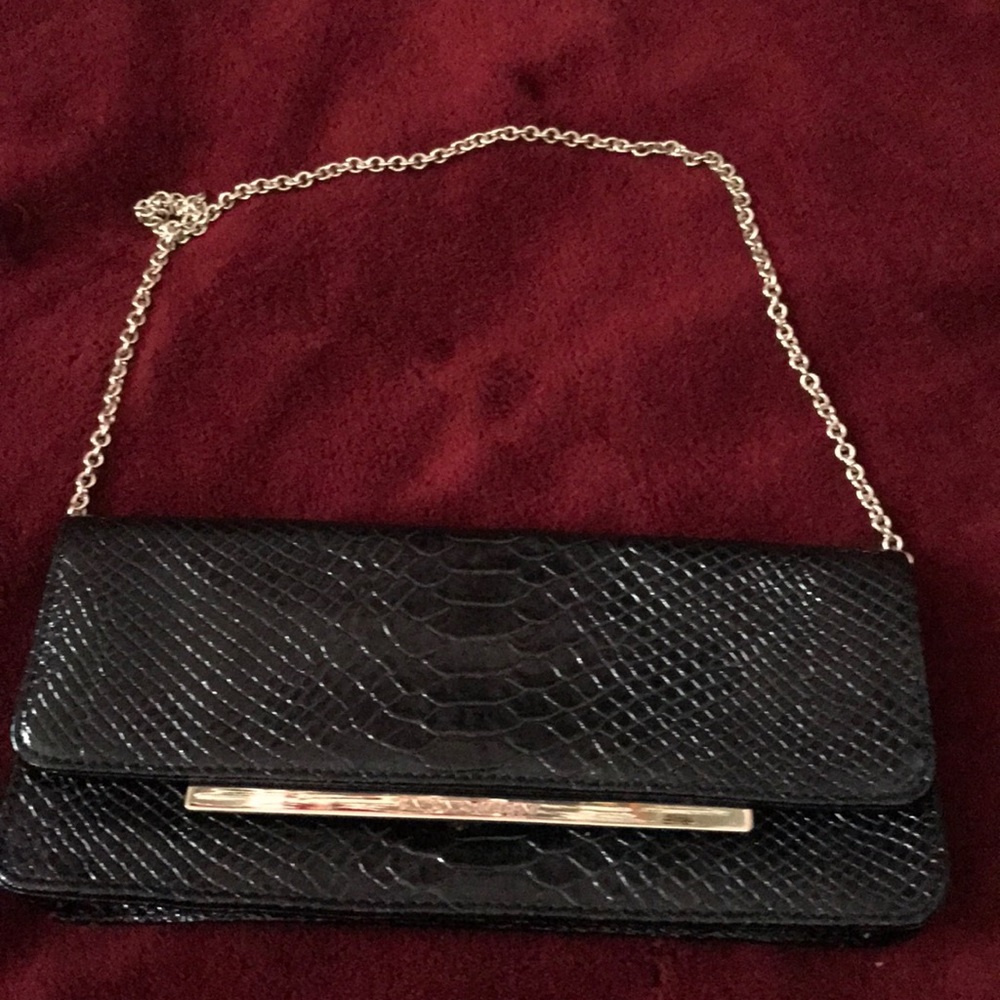 Black  clutch purse used couple of hours